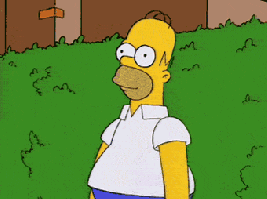 Homer backs into bush.gif
