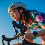 Woman Cycling with Sunglasses