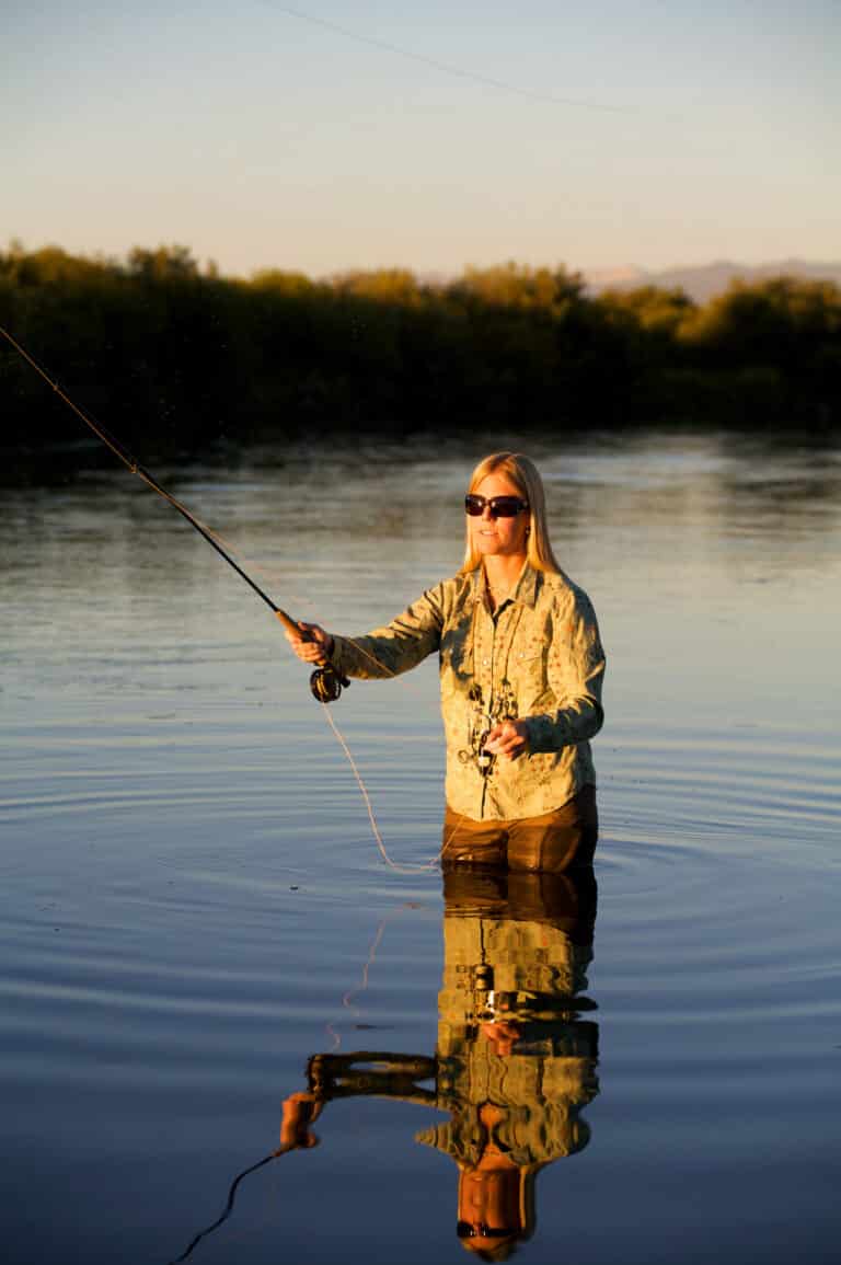 Women wearing sunglasses while fishing