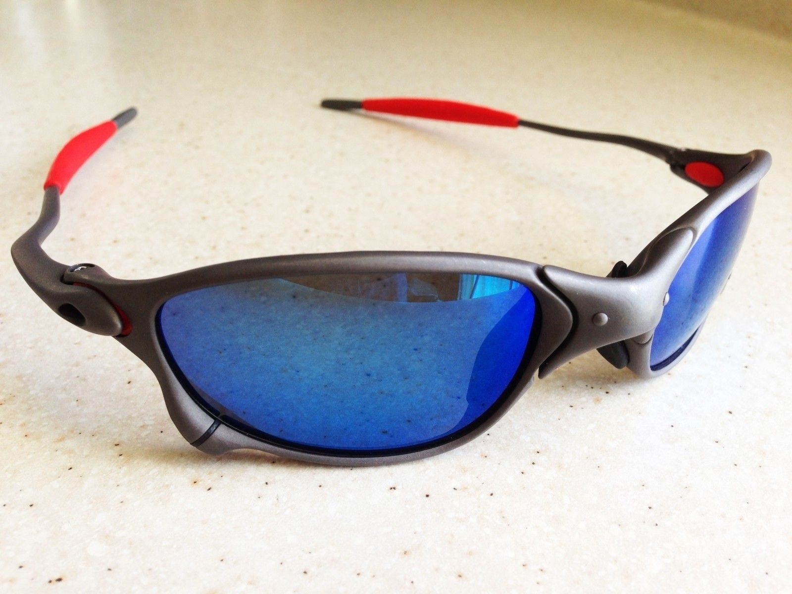 OAKLEY XX / X-METAL Sunglasses - BLUE IRIDIUM POLARIZED LENSES - Front Left View